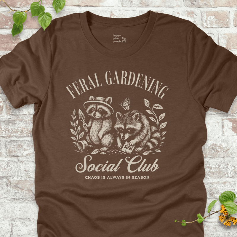 Brown gardening tee with raccoon design and funny chaos quote. Ideal gift for gardeners and nature lovers