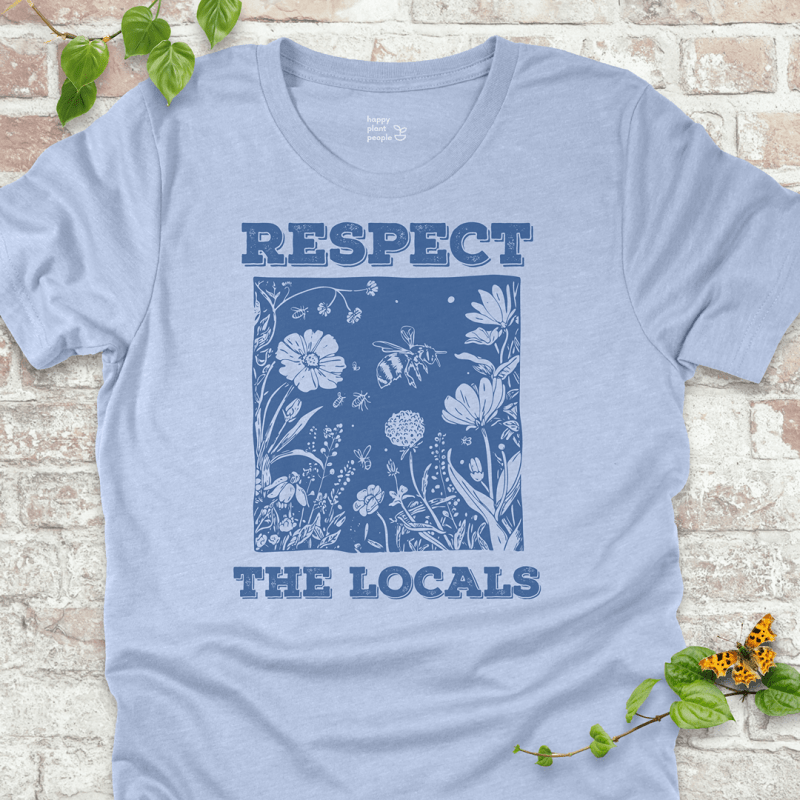 Light Blue Respect the Locals T-shirt with wildflowers and pollinators