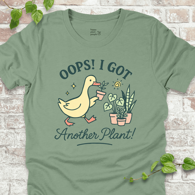 Got Another Plant T-Shirt – silly goose holding houseplants with fun garden quote on sage shirt