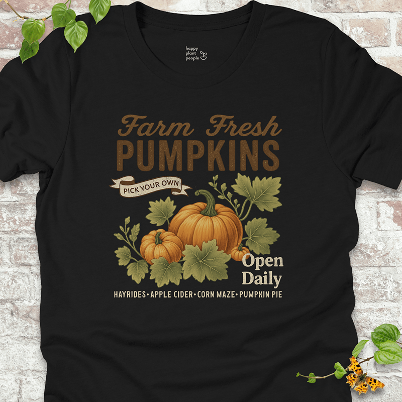 Autumn garden tee featuring a retro pumpkin design on a classic black shirt for spooky season and beyond