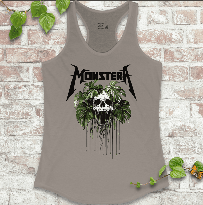 Ladies racerback tank top in grey with a bold skull and Monstera leaf design. Sleeveless houseplant shirt for plant lovers with attitude.