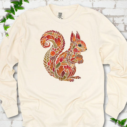 Espresso Comfort Colors® long sleeve T-shirt flat lay with an autumn squirrel graphic made from colorful leaves, ferns and flowers.