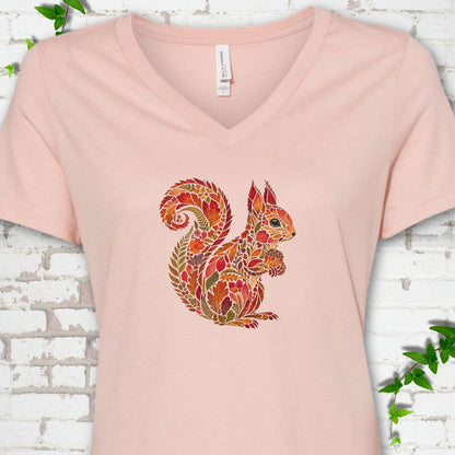 Heather Olive Bella Canvas® V-neck T-shirt flat lay with an autumn squirrel graphic made from colorful leaves, ferns and flowers.