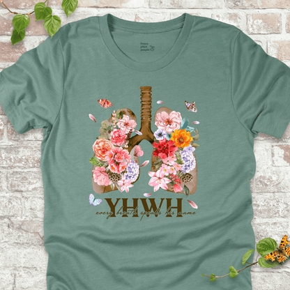 Dusty Blue YHWH Floral T‑Shirt with blooming lungs and fluttering butterflies.