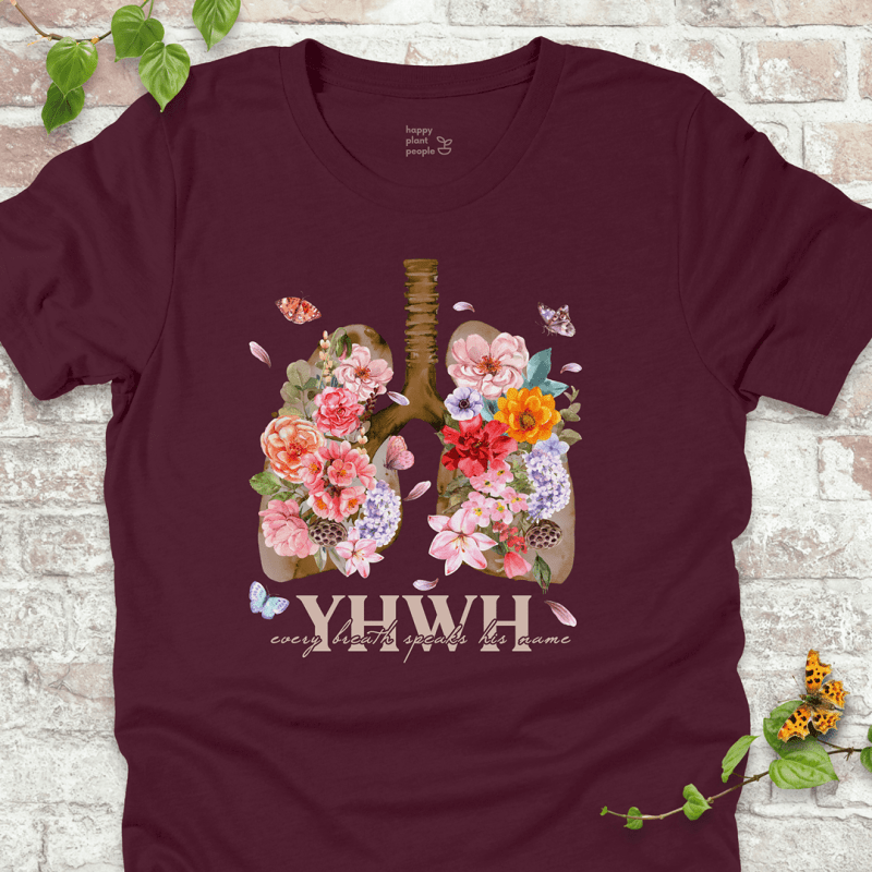 Maroon YHWH Floral T‑Shirt with blooming lungs and fluttering butterflies.