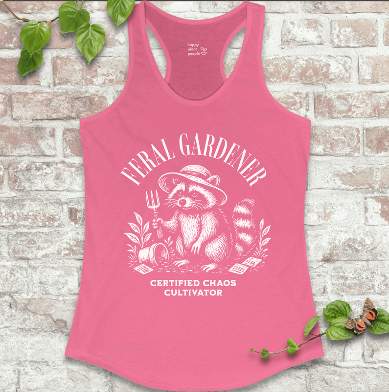 Ladies racerback tank top in pink with “Feral Gardener – Certified Chaos Cultivator” and raccoon graphic. Funny sleeveless garden shirt for plant lovers.