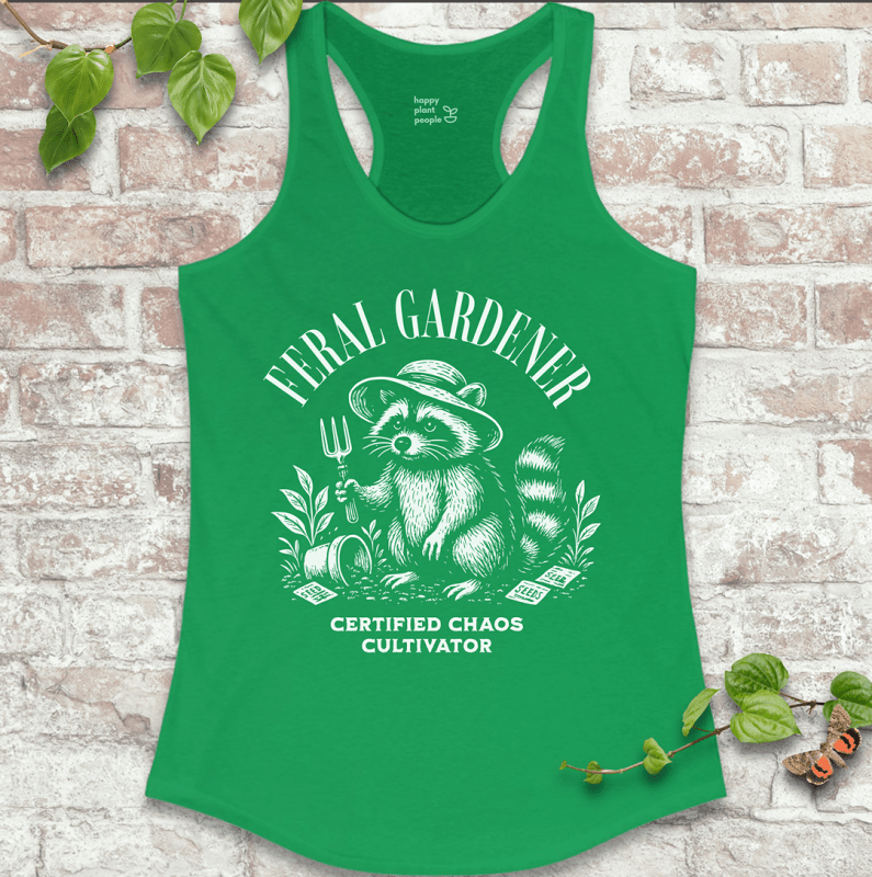 Ladies racerback tank top in green with “Feral Gardener – Certified Chaos Cultivator” and raccoon graphic. Funny sleeveless garden shirt for plant lovers.