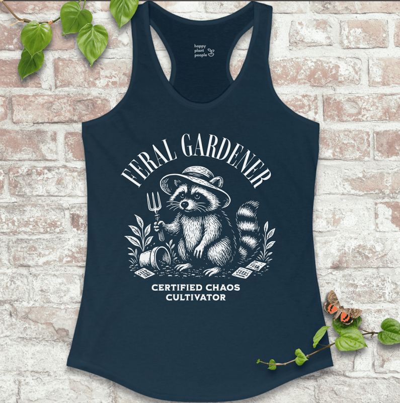 Ladies racerback tank top in navy with “Feral Gardener – Certified Chaos Cultivator” and raccoon graphic. Funny sleeveless garden shirt for plant lovers.