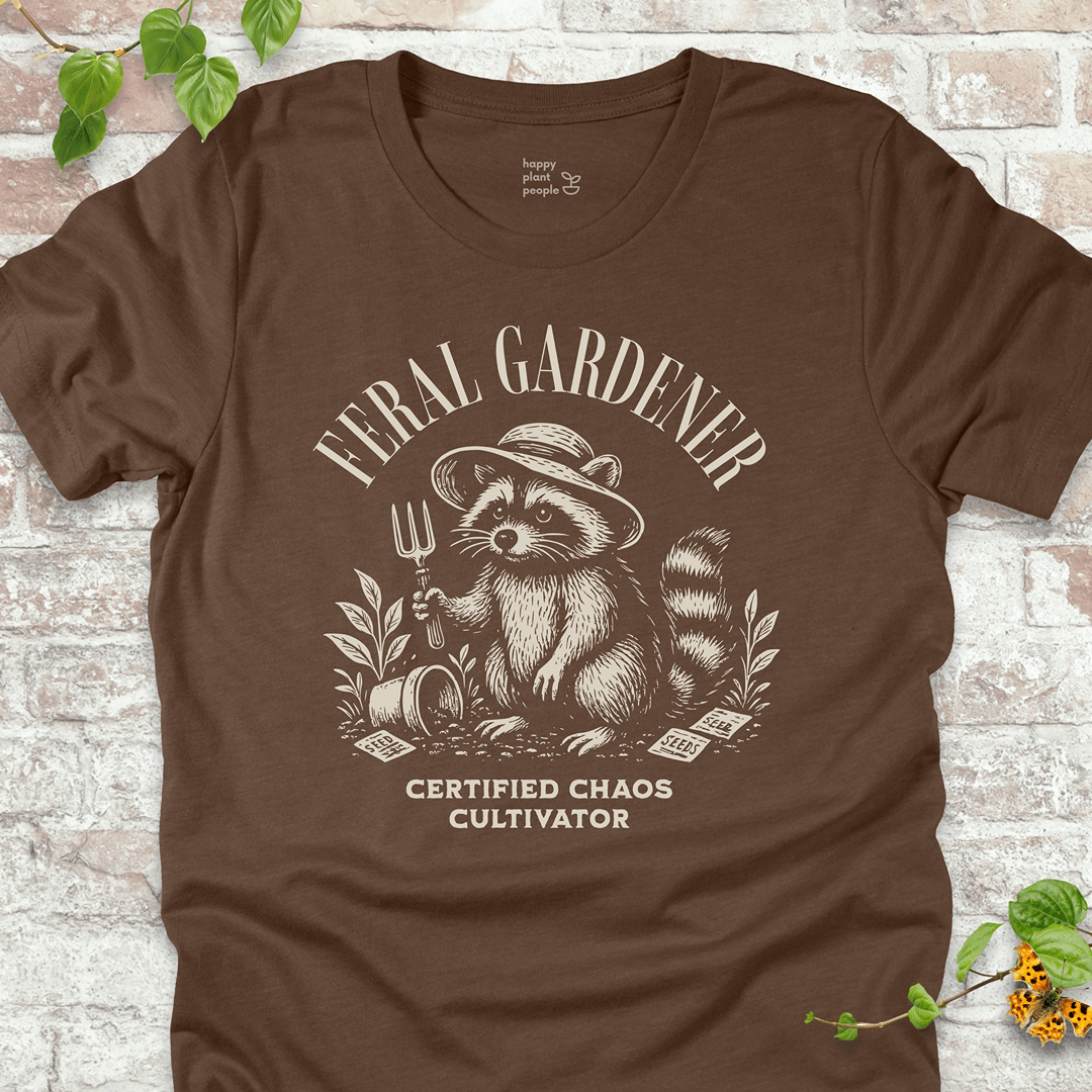 Brown gardening T-shirt with vintage raccoon and “Certified Chaos Cultivator” slogan. Funny gift for plant lovers and gardeners.