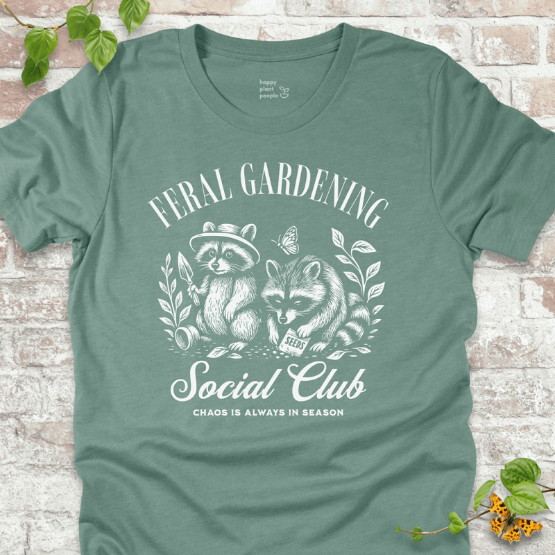 Dusty Blue gardening tee with raccoon design and funny chaos quote. Ideal gift for gardeners and nature lovers