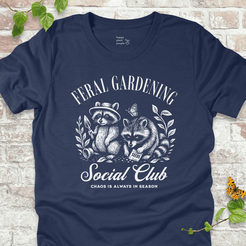 Navy Blue gardening T-shirt with vintage raccoons and ‘Chaos Is Always in Season’ slogan. Fun gift for plant lovers.”
