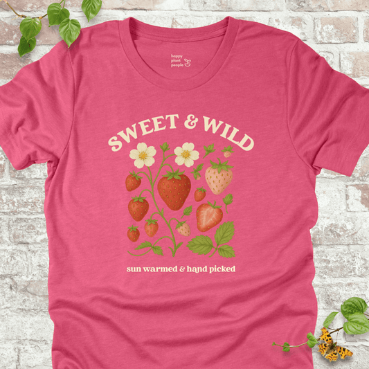 Sweet & Wild Strawberry T-Shirt in Heather Raspberry, featuring vintage-style strawberry illustration and cream text on soft Bella+Canvas tee.