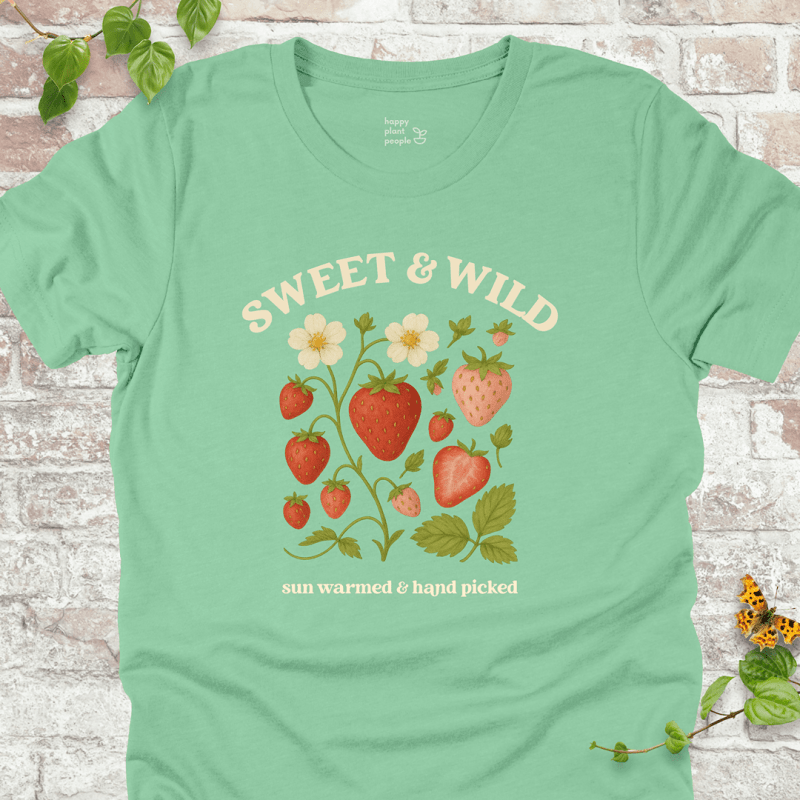 Sweet & Wild Strawberry T-Shirt in Mint, featuring vintage-style strawberry illustration and cream text on soft Bella+Canvas tee.