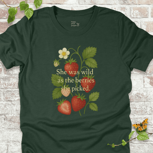 She Was Wild T-Shirt in Forest Green, featuring strawberries, green leaves, and the quote 'She was wild as the berries she picked' on soft Bella+Canvas tee.