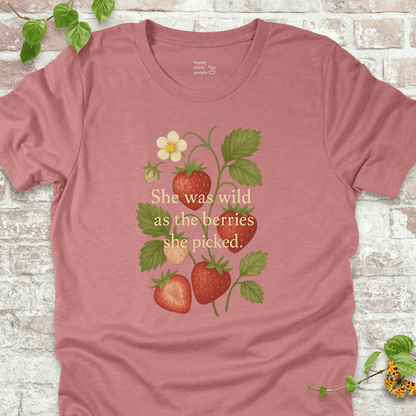 She Was Wild T-Shirt in Heather Mauve, featuring strawberries, green leaves, and the quote 'She was wild as the berries she picked' on soft Bella+Canvas tee