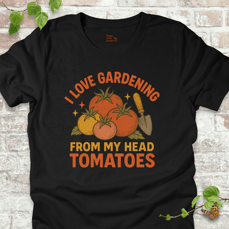 Tomatoes T-Shirt in Black Heather, featuring a pile of hand-drawn tomatoes, garden trowel, and the pun 'I Love Gardening From My Head Tomatoes' on soft Bella+Canvas tee.