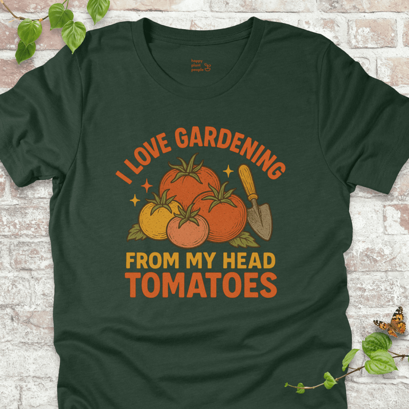 Tomatoes T-Shirt in Forest Green, featuring a pile of hand-drawn tomatoes, garden trowel, and the pun 'I Love Gardening From My Head Tomatoes' on soft Bella+Canvas tee.