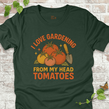 Tomatoes T-Shirt in Forest Green, featuring a pile of hand-drawn tomatoes, garden trowel, and the pun 'I Love Gardening From My Head Tomatoes' on soft Bella+Canvas tee.