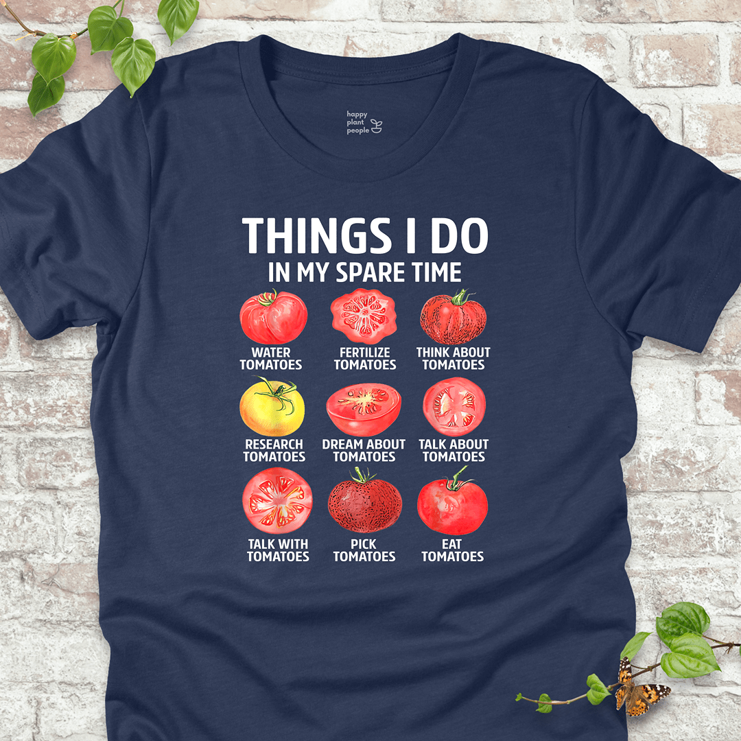 Funny tomato T-shirt in navy with a grid of tomato illustrations and a list of funny gardener habits.
