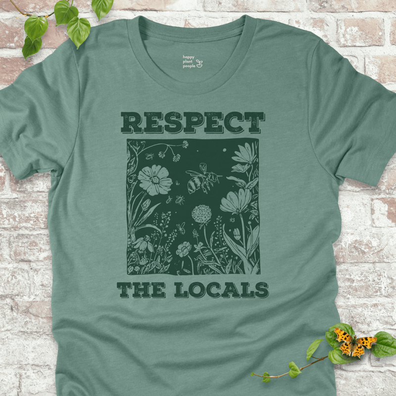 Dusty Blue Respect the Locals T-shirt with wildflowers and pollinators