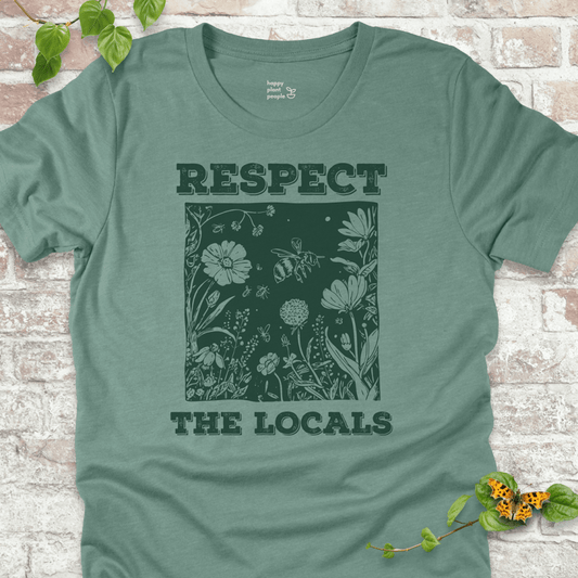Dusty Blue Respect the Locals T-shirt with wildflowers and pollinators
