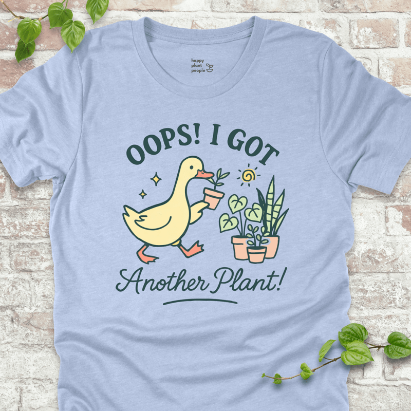 Got Another Plant T-Shirt – silly goose holding houseplants with fun garden quote on blue shirt