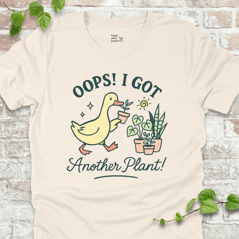 Got Another Plant T-Shirt – silly goose holding houseplants with fun garden quote on natural shirt