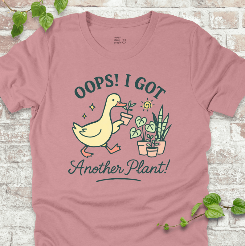 Got Another Plant T-Shirt – silly goose holding houseplants with fun garden quote on pink shirt