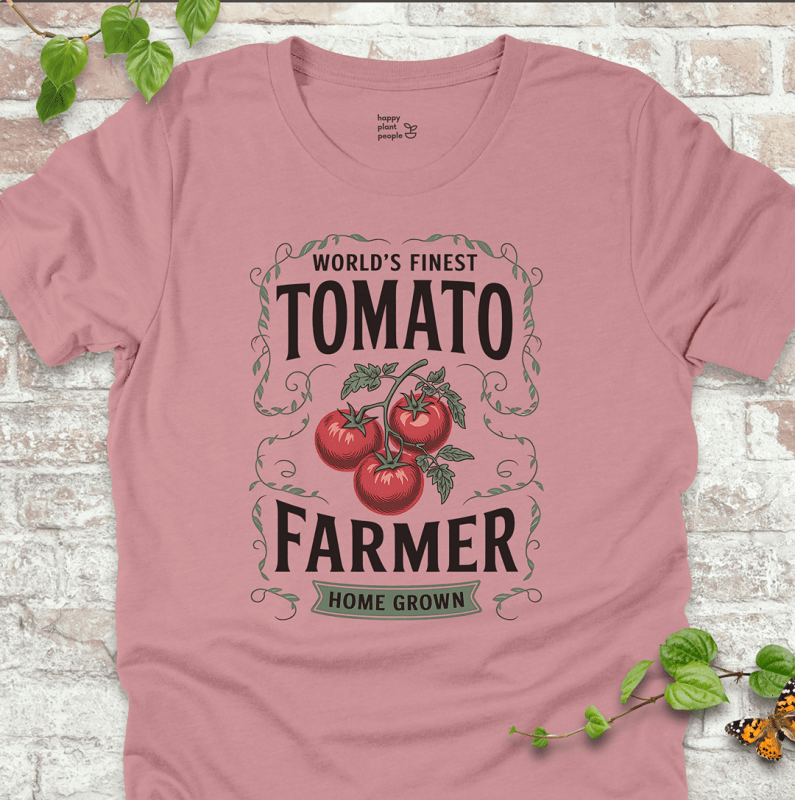 Tomato Farmer T-Shirt – heirloom tomato design with bold text on dusty pink shirt