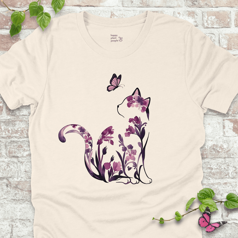 Ladies T-shirt in natural with a floral cat illustration. Whimsical garden-themed shirt for cat lovers and flower fans.