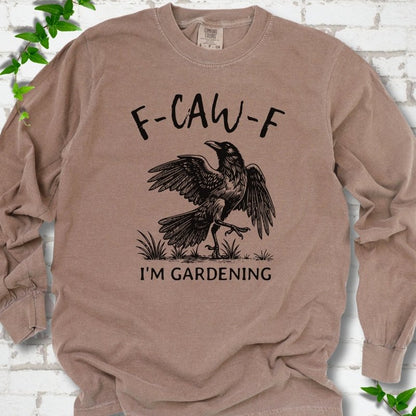 Espresso Comfort Colors® long sleeve T-shirt flat lay featuring a black crow with F-CAW-F I'm Gardening text.