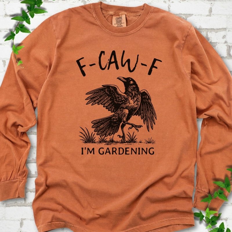 Yam Comfort Colors® long sleeve T-shirt flat lay featuring a black crow with F-CAW-F I'm Gardening text.