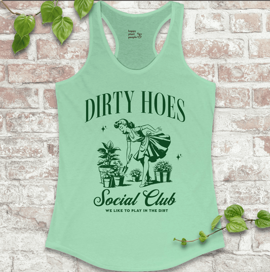 Ladies racerback tank top in mint green with “Dirty Hoes Social Club” and vintage garden tool graphic. Funny sleeveless shirt for women who love gardening.

