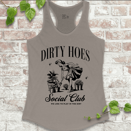 Ladies racerback tank top in grey with “Dirty Hoes Social Club” and vintage garden tool graphic. Funny sleeveless shirt for women who love gardening.

