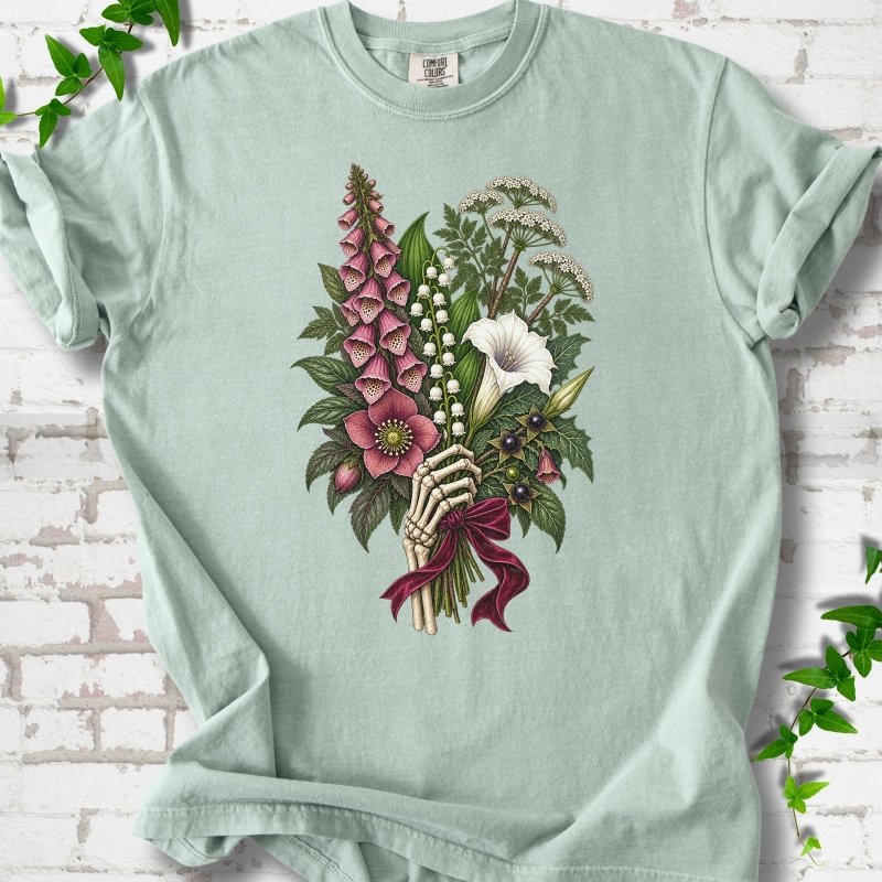 Bay Comfort Colors® T-shirt flat lay featuring a poisonous flower bouquet held by skeletal hands.