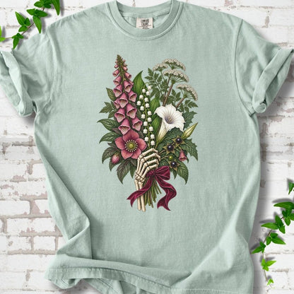 Bay Comfort Colors® T-shirt flat lay featuring a poisonous flower bouquet held by skeletal hands.