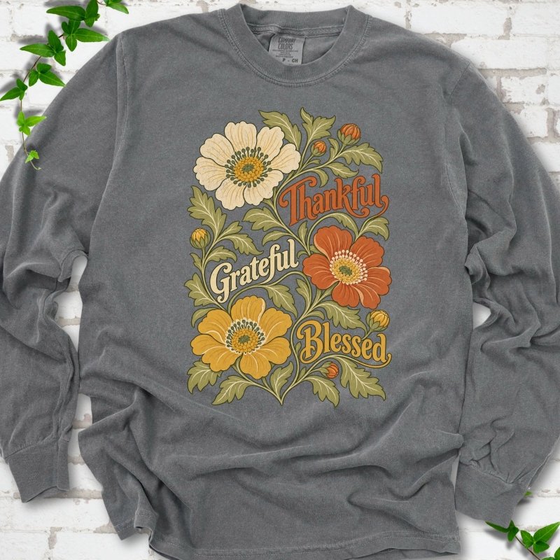 Pepper long sleeve T-shirt flat-lay mockup with orange, cream and yellow flowers framing "Thankful, Grateful, Blessed" lettering.