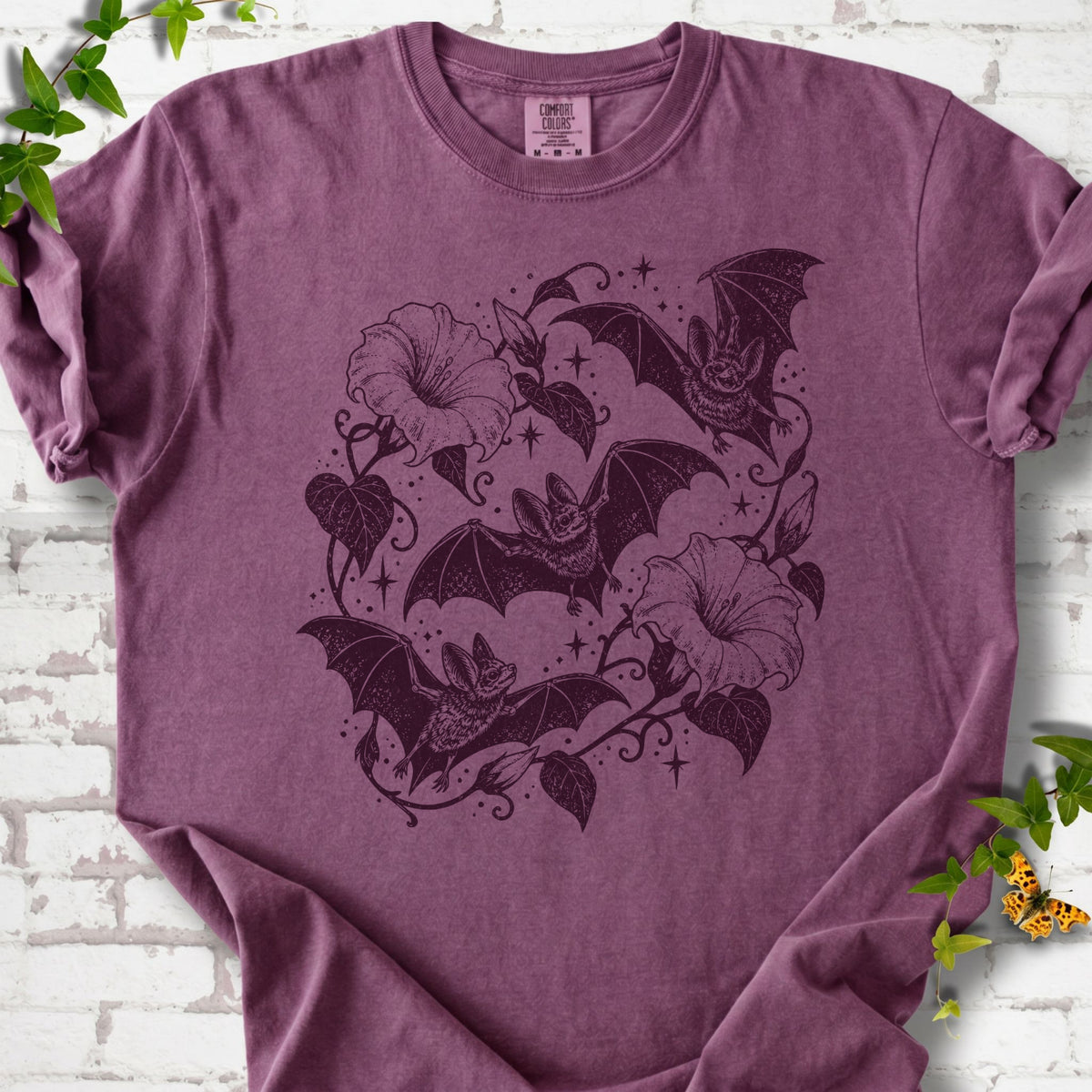 Bats In Bloom botanical bat T-shirt in Berry with black bats and trumpet flowers