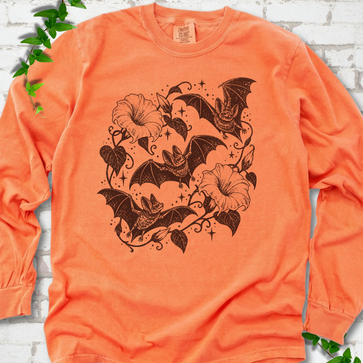 Bats In Bloom botanical bat long sleeve shirt in Melon with black bats and trumpet flowers