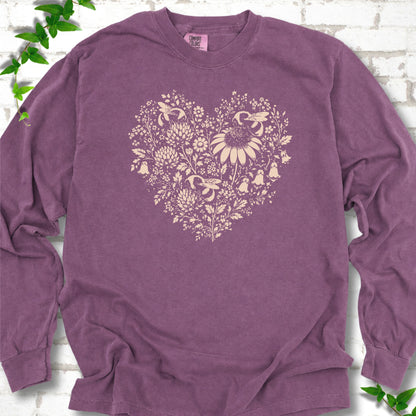 Berry Comfort Colors® long sleeve T-shirt front mockup featuring three bumblebees among wildflowers in a heart-shaped design.