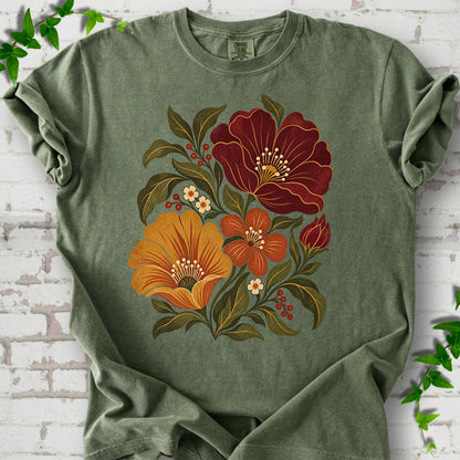 Moss T-shirt front-view mockup with a large burgundy, ochre and rust retro floral graphic.