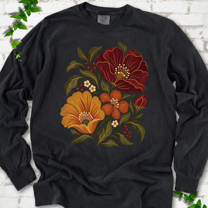 Black long sleeve T-shirt front-view mockup with a large burgundy, ochre and rust retro floral graphic.