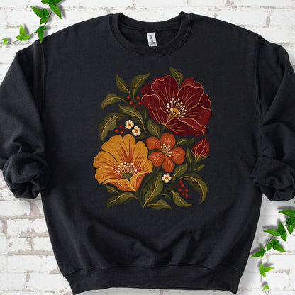 Black sweatshirt front-view mockup with a large burgundy, ochre and rust retro floral graphic.