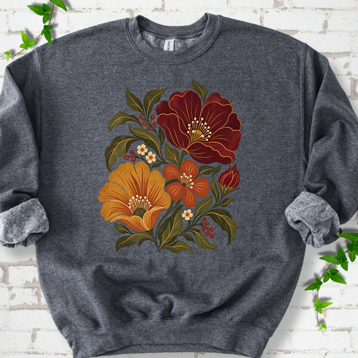 Dark Heather sweatshirt front-view mockup with a large burgundy, ochre and rust retro floral graphic.