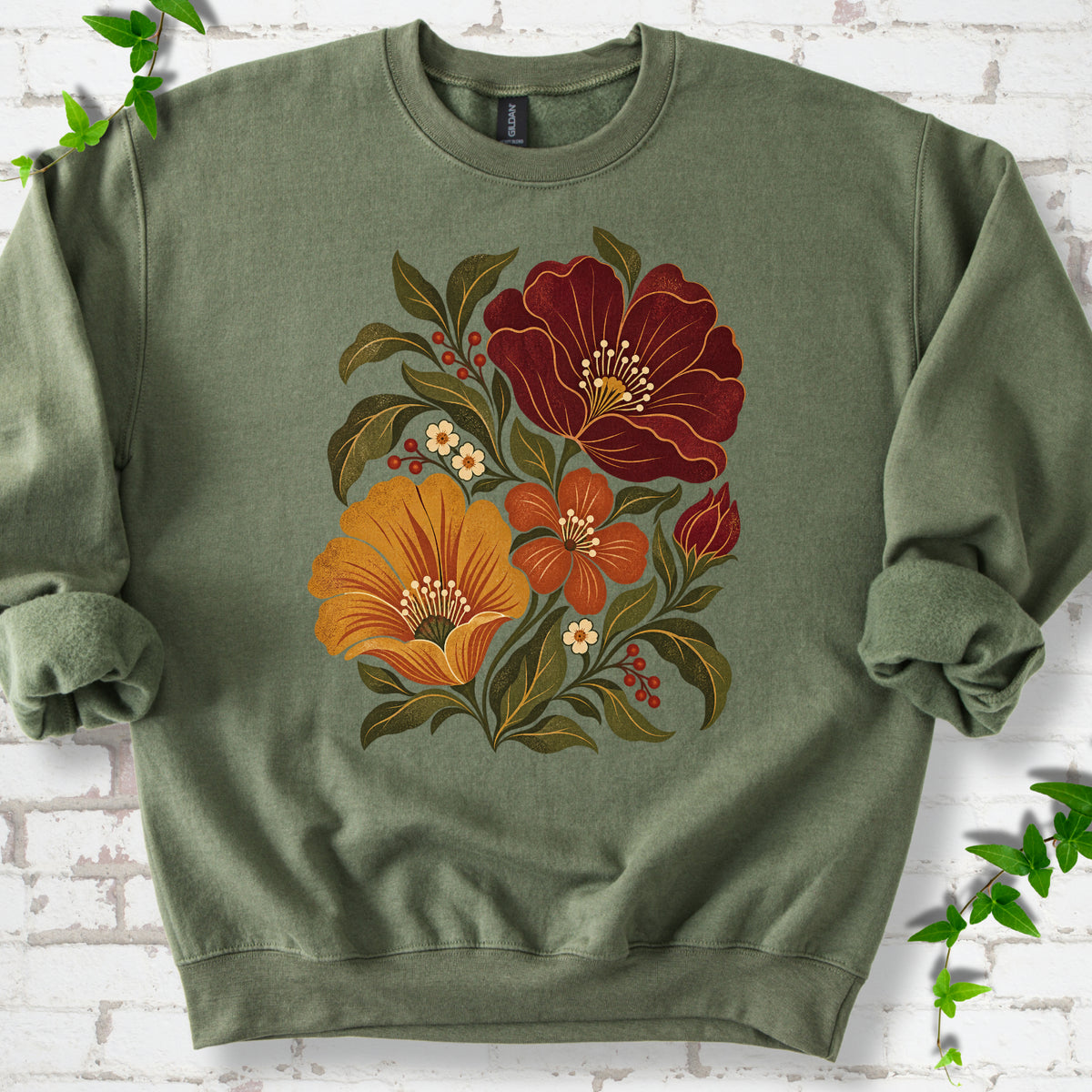 Military Green sweatshirt front-view mockup with a large burgundy, ochre and rust retro floral graphic.