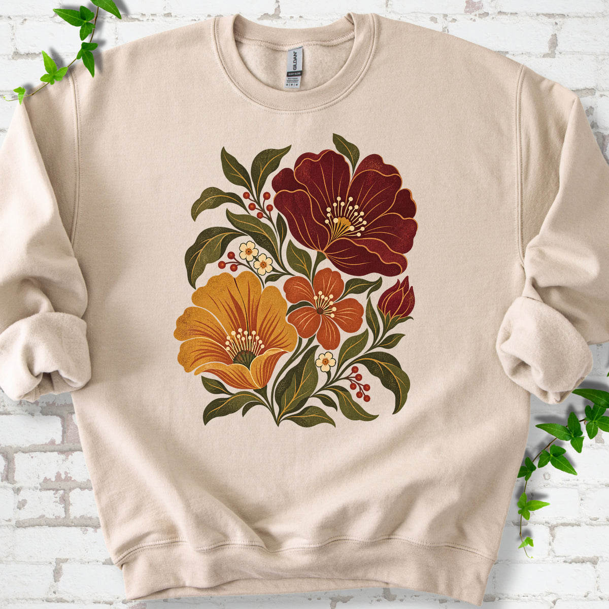 Sand sweatshirt front-view mockup with a large burgundy, ochre and rust retro floral graphic.