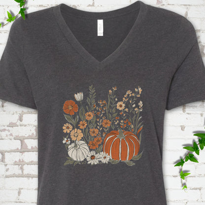 Dark Grey Heather Bella Canvas® V-neck T-shirt flat lay featuring an orange pumpkin surrounded by cream and orange wildflowers.