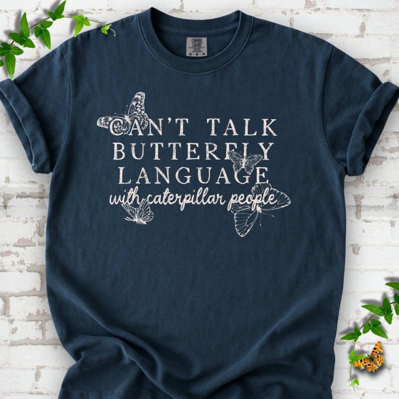 Midnight Comfort Colors® T-shirt featuring a cream Can't Talk Butterfly Language with Caterpillar People graphic with butterflies