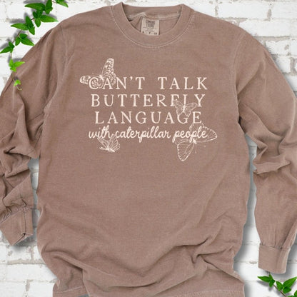 Espresso Comfort Colors® long sleeve T-shirt featuring a cream Can't Talk Butterfly Language with Caterpillar People graphic with butterflies