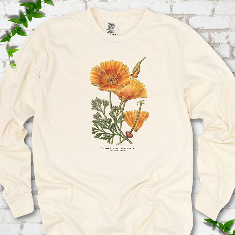 Ivory Comfort Colors® long sleeve T-shirt flat lay featuring a vintage botanical California poppy illustration.